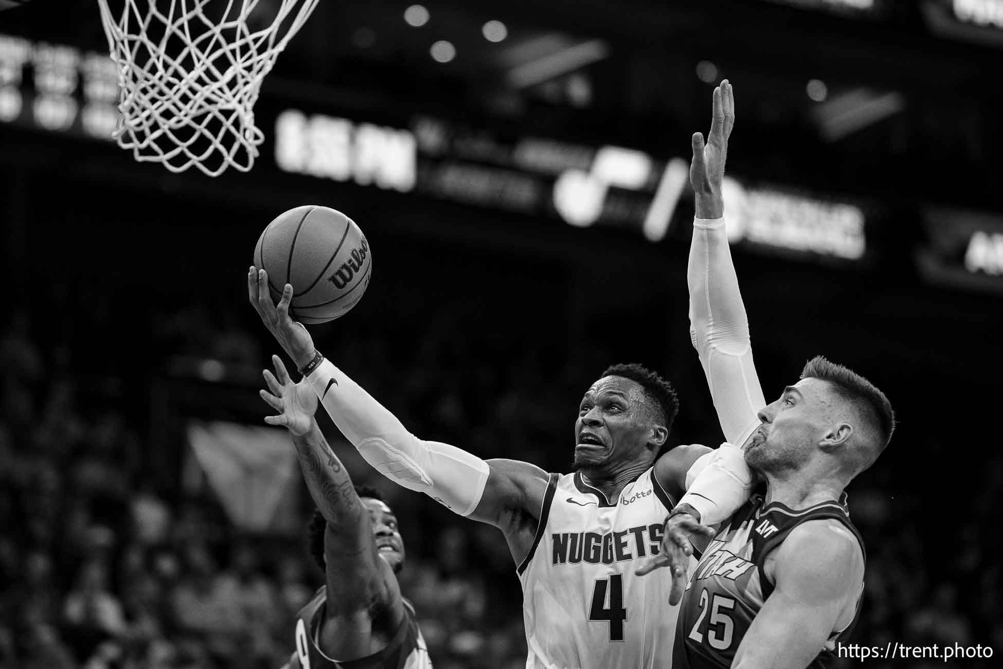 (Trent Nelson  |  The Salt Lake Tribune) Denver Nuggets guard Russell Westbrook (4) drives past Utah Jazz center Micah Potter (25) as the Utah Jazz host the Denver Nuggets, NBA basketball in Salt Lake City on Wednesday, Nov. 27, 2024.