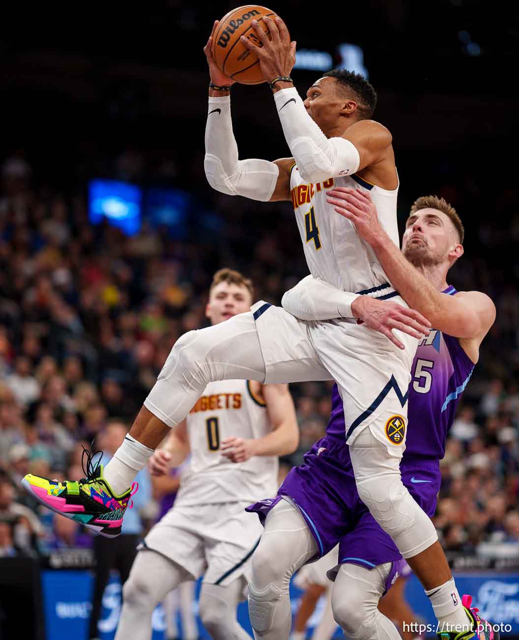 (Trent Nelson  |  The Salt Lake Tribune) Utah Jazz center Micah Potter (25) latches onto Denver Nuggets guard Russell Westbrook (4) as the Utah Jazz host the Denver Nuggets, NBA basketball in Salt Lake City on Wednesday, Nov. 27, 2024.