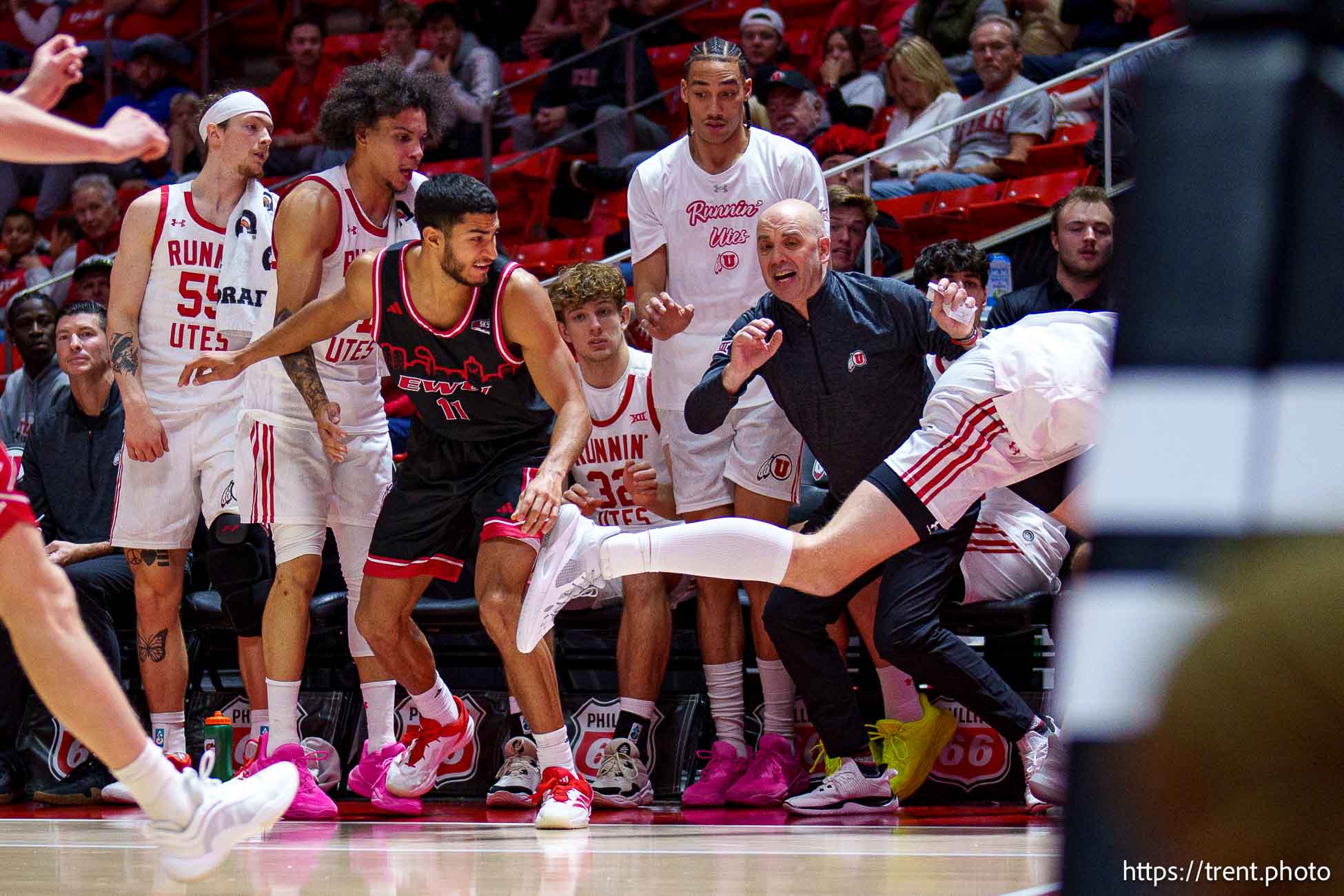 (Trent Nelson  |  The Salt Lake Tribune) Utah Utes center Lawson Lovering (34) flies out of bounds past coach Craig Smith as Utah hosts Eastern Washington, NCAA basketball in Salt Lake City on Saturday, Nov. 30, 2024.