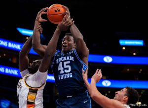 (Trent Nelson  |  The Salt Lake Tribune) Brigham Young Cougars center Fousseyni Traore (45) and Wyoming Cowboys center Scottie Ebube (12) as BYU faces Wyoming, NCAA basketball in Salt Lake City on Saturday, Dec. 14, 2024.