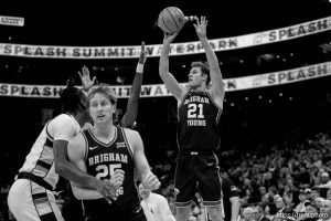 (Trent Nelson  |  The Salt Lake Tribune) Brigham Young Cougars guard Trevin Knell (21) shoots as BYU faces Wyoming, NCAA basketball in Salt Lake City on Saturday, Dec. 14, 2024.