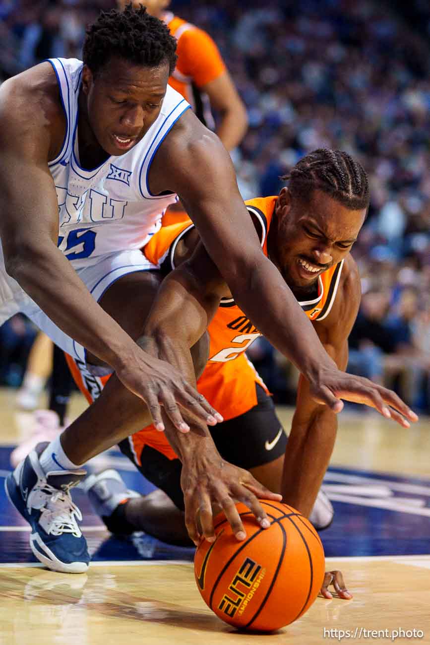 (Trent Nelson  |  The Salt Lake Tribune) Brigham Young Cougars center Fousseyni Traore (45) and Oklahoma State Cowboys forward Robert Jennings II (25) as BYU hosts Oklahoma State, NCAA basketball in Provo on Tuesday, Jan. 14, 2025.