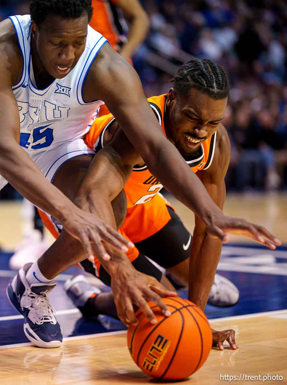 (Trent Nelson  |  The Salt Lake Tribune) Brigham Young Cougars center Fousseyni Traore (45) and Oklahoma State Cowboys forward Robert Jennings II (25) as BYU hosts Oklahoma State, NCAA basketball in Provo on Tuesday, Jan. 14, 2025.