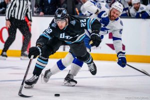 (Trent Nelson  |  The Salt Lake Tribune) Utah Hockey Club center Jack McBain (22) and Tampa Bay Lightning center Zemgus Girgensons (28) as Utah Hockey Club hosts the Tampa Bay Lightning, NHL hockey at the Delta Center in Salt Lake City on Saturday, March 22, 2025.