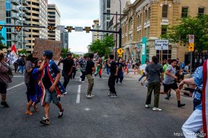 (Trent Nelson | The Salt Lake Tribune) People run after three shots were fired during 'No Kings' protest march in Salt Lake City, Saturday, June 14, 2025.
