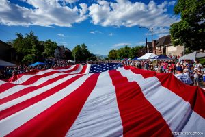(Trent Nelson  |  The Salt Lake Tribune) A large flag is carried down University Avenue at the Grand Parade for AmericaÕs Freedom Festival in Provo on Friday, July 4, 2025.