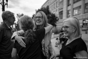 (Trent Nelson  |  The Salt Lake Tribune) Emma Petty Addams, of Mormon Women for Ethical Government, embraces other activists at a news conference in Salt Lake City on Monday, Aug. 25, 2025. A judge earlier ruled that the Legislature will have 30 days to adopt new maps that comply with the 2018 Better Boundaries initiative guidelines. At right is Katharine Biele, of League of Women Voters of Utah.