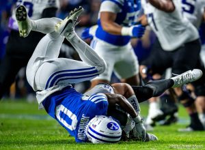 (Trent Nelson  |  The Salt Lake Tribune) BYU Cougars defensive back Evan Johnson (0) sacks Texas Christian University Horned Frogs quarterback Josh Hoover (10) as BYU hosts TCU, NCAA football in Provo on Saturday, Nov. 15, 2025.
