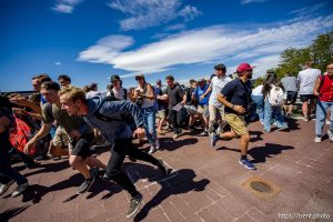 (Trent Nelson  |  The Salt Lake Tribune) People react after Charlie Kirk is shot during an appearance at Utah Valley University in Orem on Wednesday, Sept. 10, 2025.
