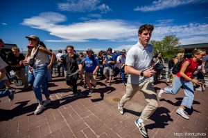 (Trent Nelson  |  The Salt Lake Tribune) People react after Charlie Kirk is shot during an appearance at Utah Valley University in Orem on Wednesday, Sept. 10, 2025.