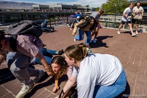 (Trent Nelson  |  The Salt Lake Tribune) People react after Charlie Kirk is shot during an appearance at Utah Valley University in Orem on Wednesday, Sept. 10, 2025.