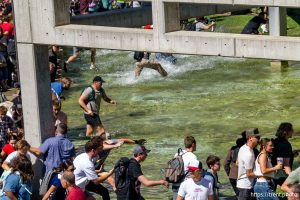 (Trent Nelson  |  The Salt Lake Tribune) People react after Charlie Kirk is shot during an appearance at Utah Valley University in Orem on Wednesday, Sept. 10, 2025.