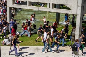 (Trent Nelson  |  The Salt Lake Tribune) People react after Charlie Kirk is shot during an appearance at Utah Valley University in Orem on Wednesday, Sept. 10, 2025.