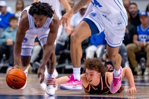 (Trent Nelson  |  The Salt Lake Tribune) BYU Cougars guard Robert Wright III (1) picks up a loose ball as BYU hosts Pacific, NCAA basketball in Provo on Tuesday, Dec. 16, 2025.