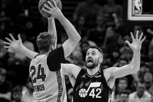 (Trent Nelson  |  The Salt Lake Tribune) Utah Jazz forward Kevin Love (42) defending Memphis Grizzlies guard Cam Spencer (24) as the Utah Jazz host the Memphis Grizzlies, NBA basketball in Salt Lake City on Tuesday, Dec. 23, 2025.